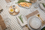 Timeless Harvest grey beige gingham cotton tablecloth featuring a classic neutral check pattern.