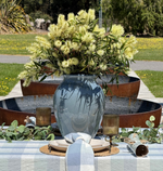 Ocean blue glazed ceramic vase featuring a softly rounded shape and rich blue tonal variations.