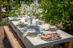 Bayleaf Bounty green gingham cotton tablecloth featuring a classic checked pattern for a rectangular dining table.