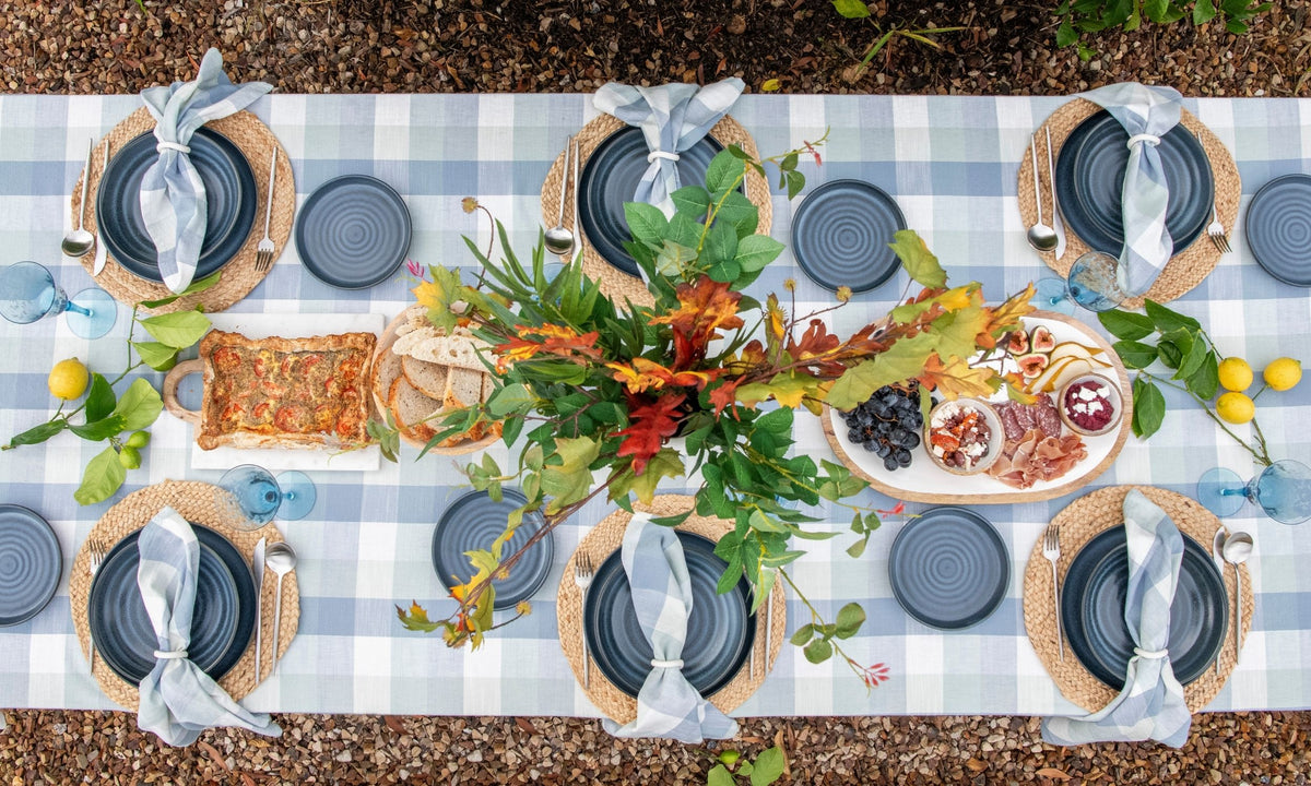 Blue Sky Gingham cotton tablecloth featuring a woven blue and seafoam gingham pattern, 150 × 300 cm.