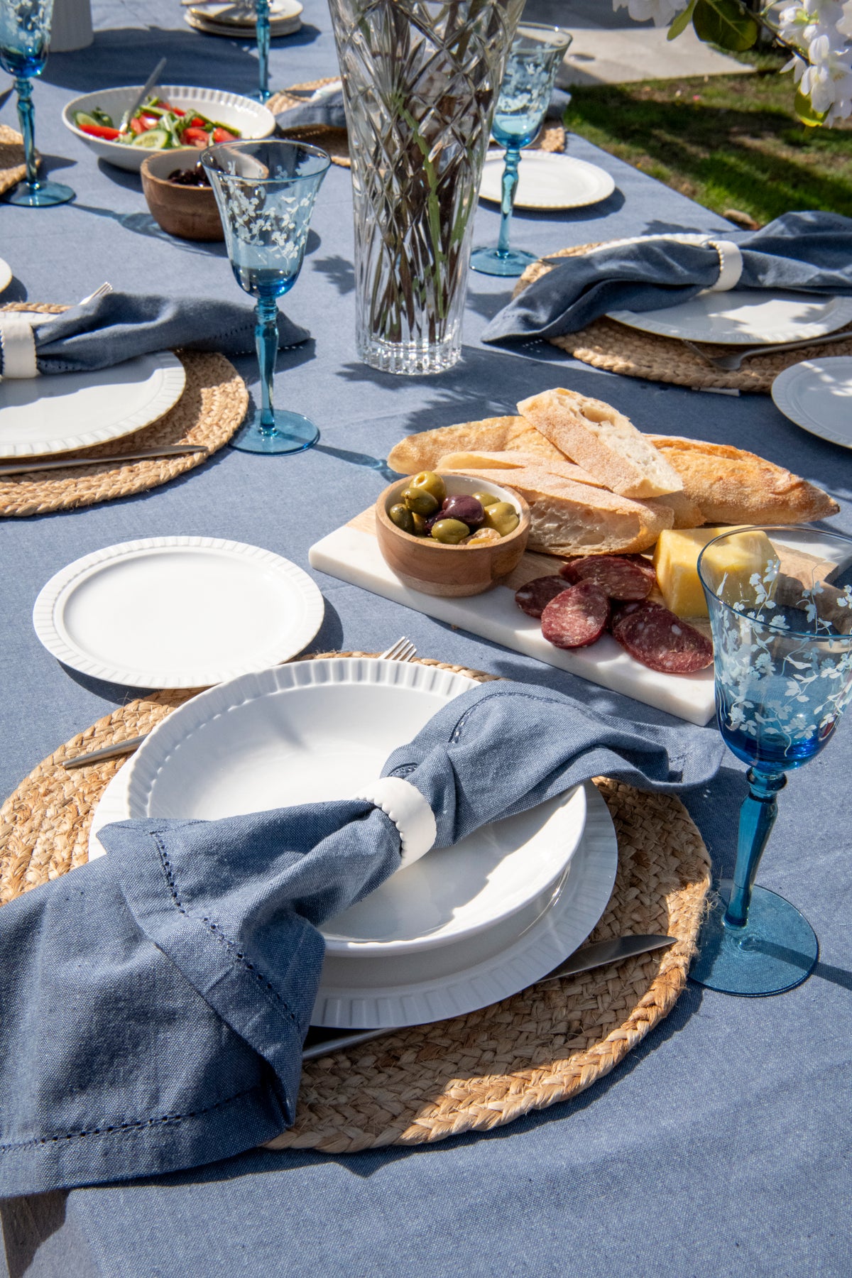 Set of four Capri Breeze dark denim blue cotton table napkins featuring decorative spoke-stitched edging.