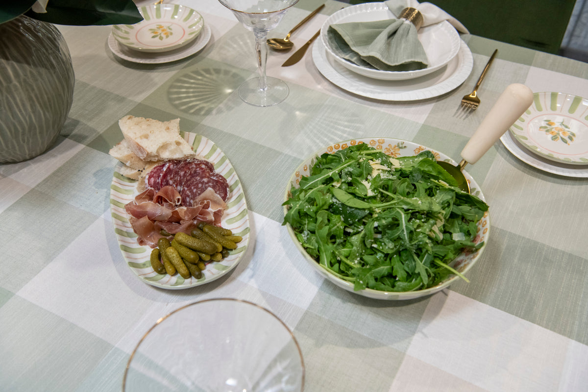 Petal Grove large pink and green ceramic serving bowl featuring a floral design and decorative striped border.