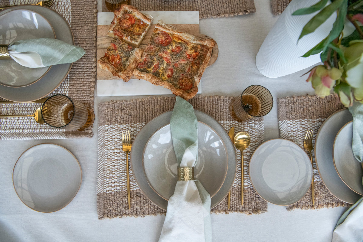 Urban Street Beige oatmeal cotton tablecloth featuring a warm neutral colour and decorative spoke-stitched edging.