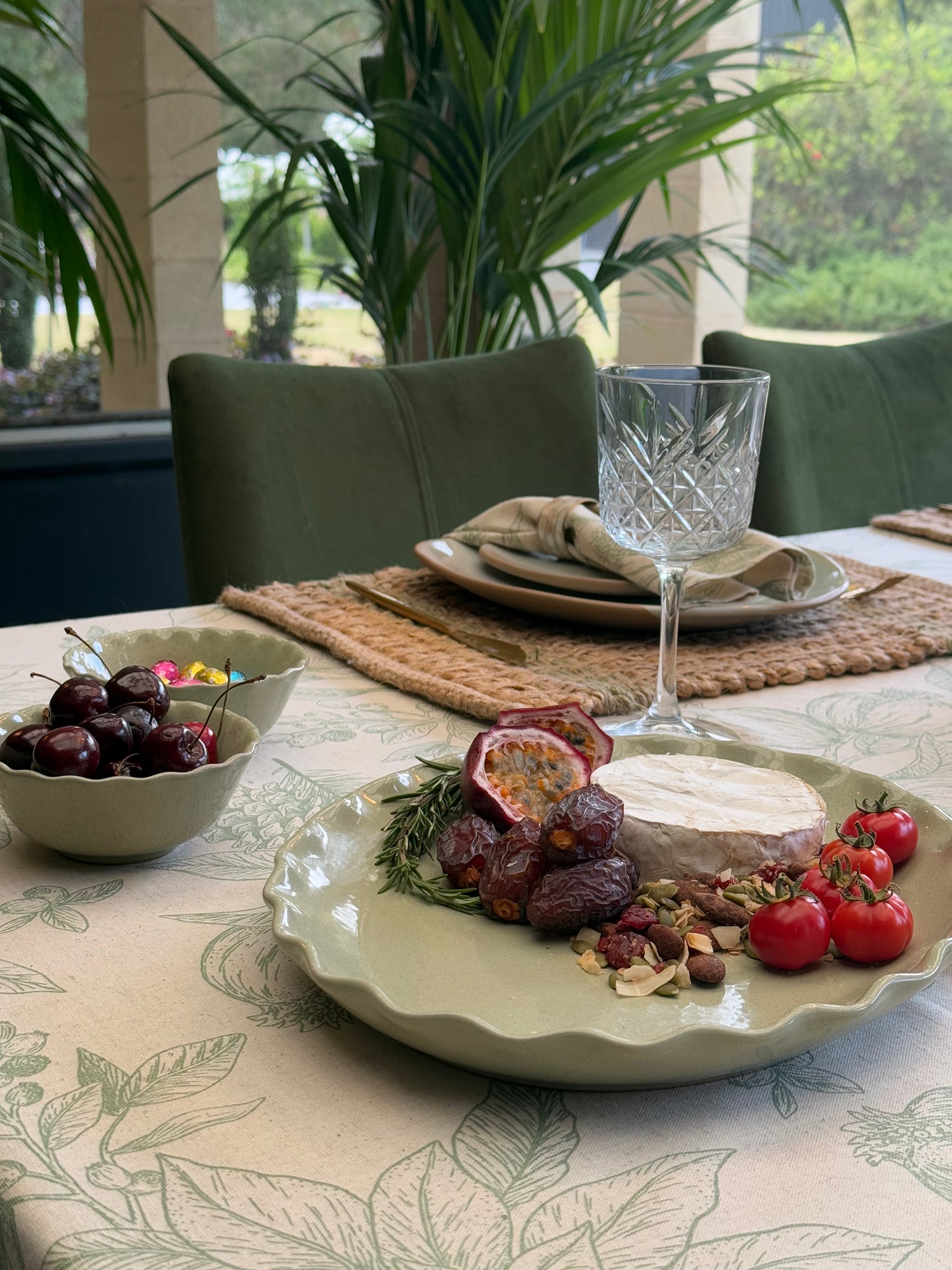 Marlow sage green oval ceramic serving platter featuring a decorative wavy rim and softly speckled glaze.
