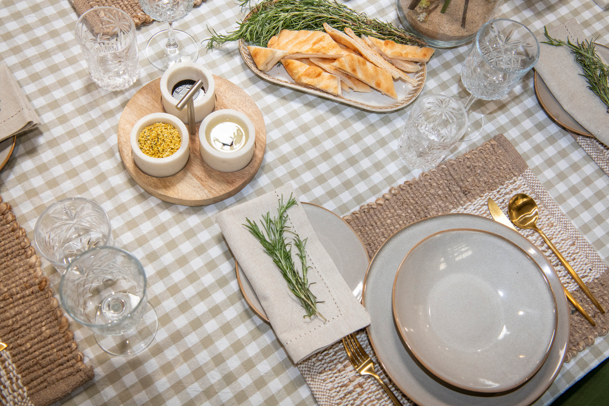 Timeless Harvest grey beige gingham cotton tablecloth featuring a classic neutral check pattern.