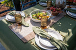 Tuscan Harvest sage green cotton tablecloth featuring a solid green colour and decorative spoke-stitched edging.