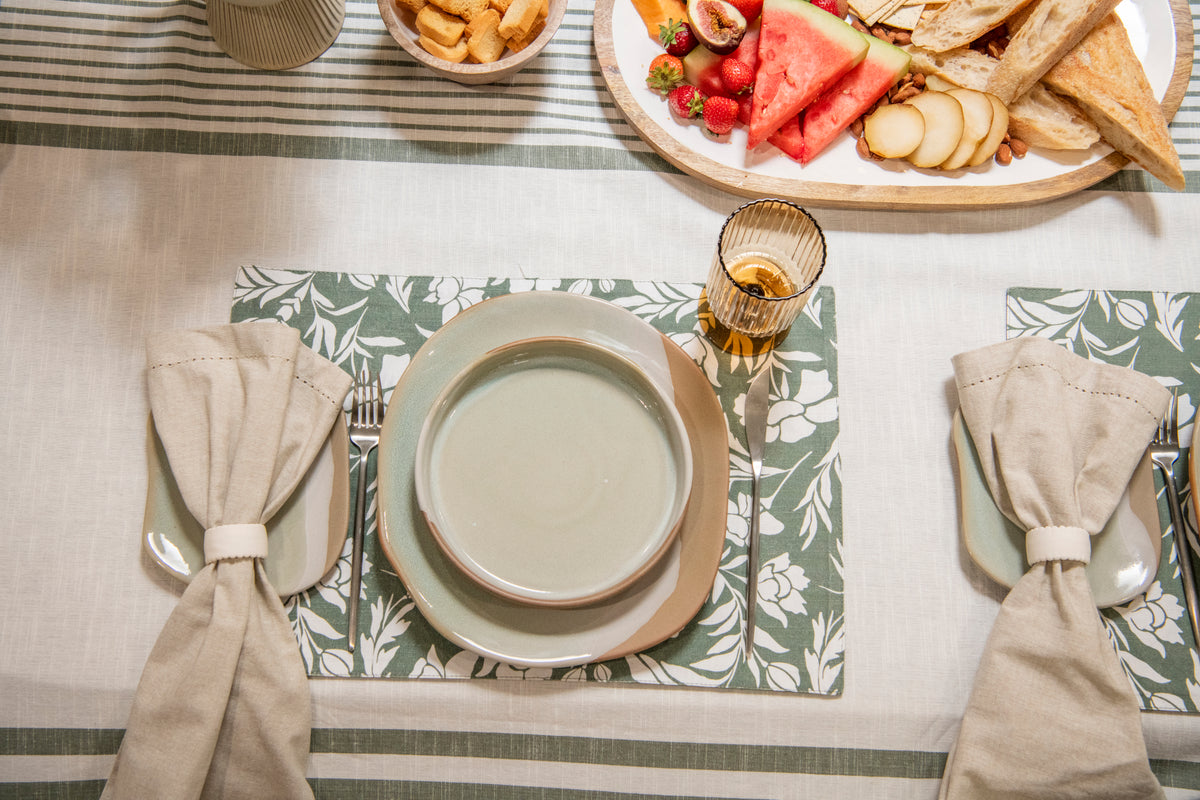 Set of four oatmeal beige cotton table napkins featuring decorative stitched edging from the Urban Street Beige tablescape.