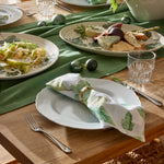 Fig & Vine green botanical table napkins set of four with fig leaves and young green figs printed on a white background.