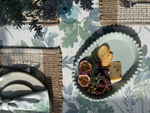 Plated dish with food on a patterned tablecloth